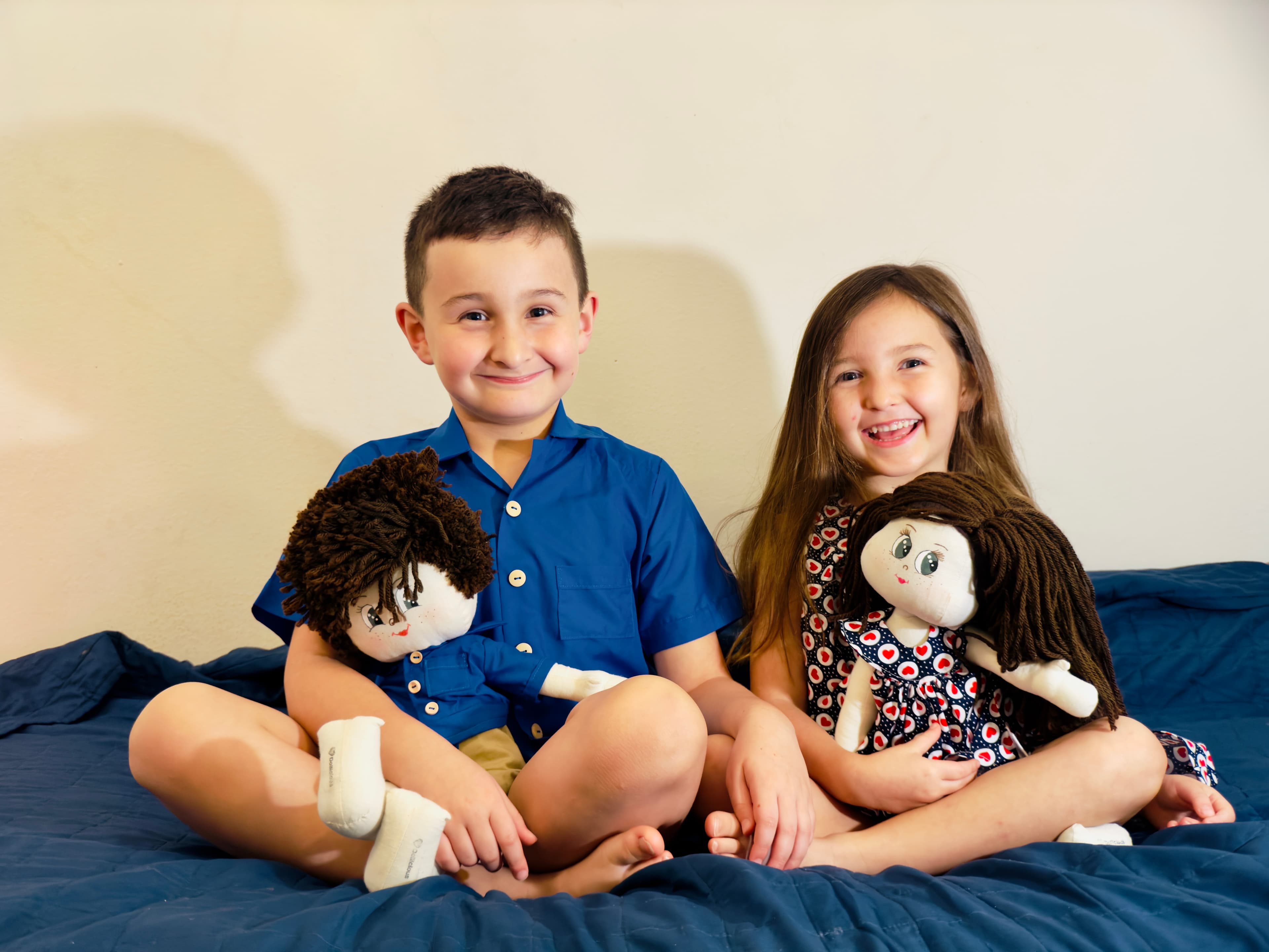 Child holding a custom doll
