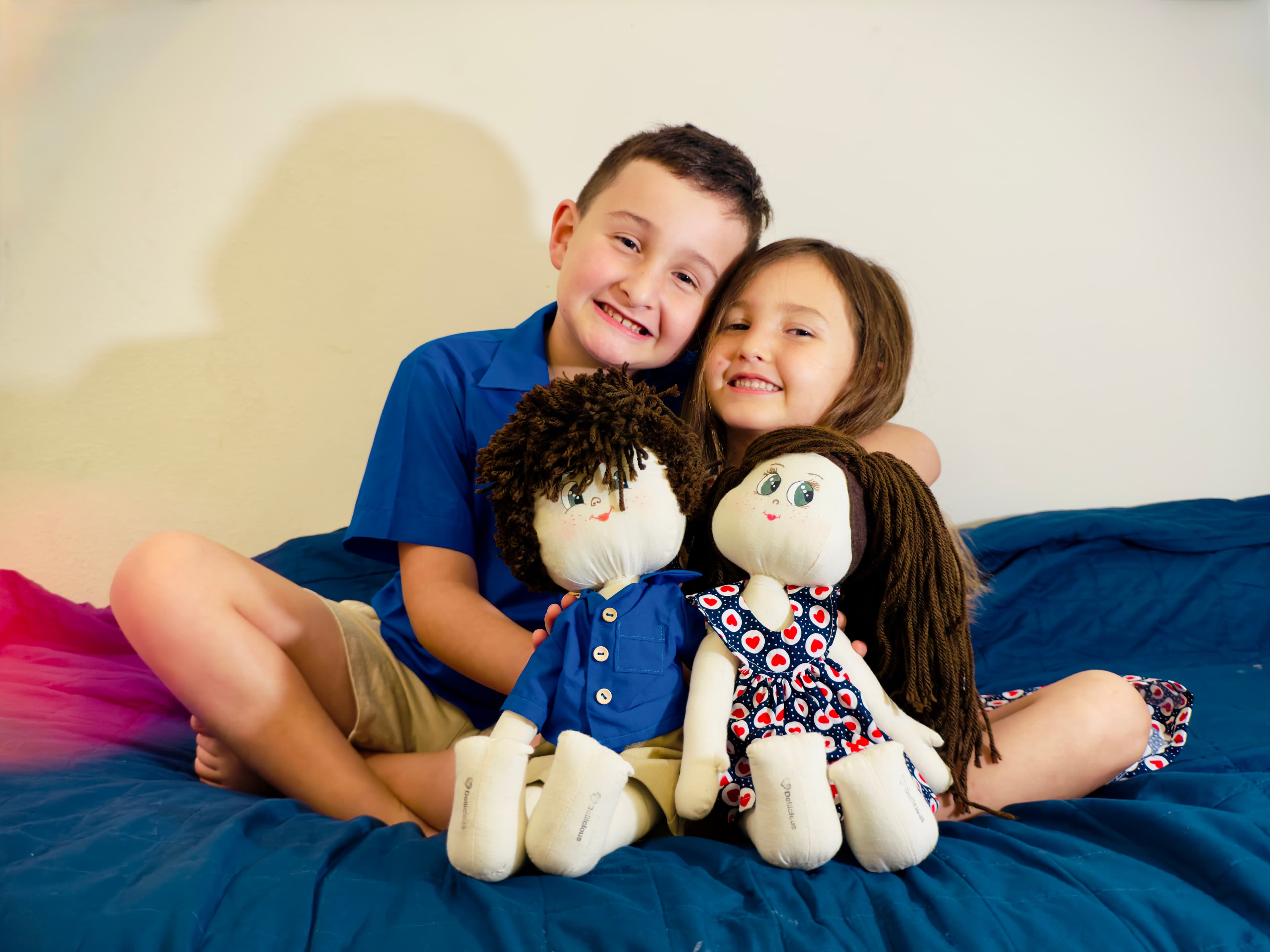 Girl smiling with her handcrafted doll